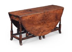 A QUEEN ANNE YEW WOOD DOUBLE GATELEG TABLE, EARLY 18TH CENTURY