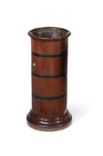 A MAHOGANY AND EBONISED CYLINDRICAL STICK, STAND IN GEORGE II STYLE, LATE 19TH CENTURY