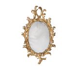 A CARVED GILTWOOD MIRROR, IN GEORGE III STYLE, IN THE MANNER OF JOHN LINNELL, MID 19TH CENTURY