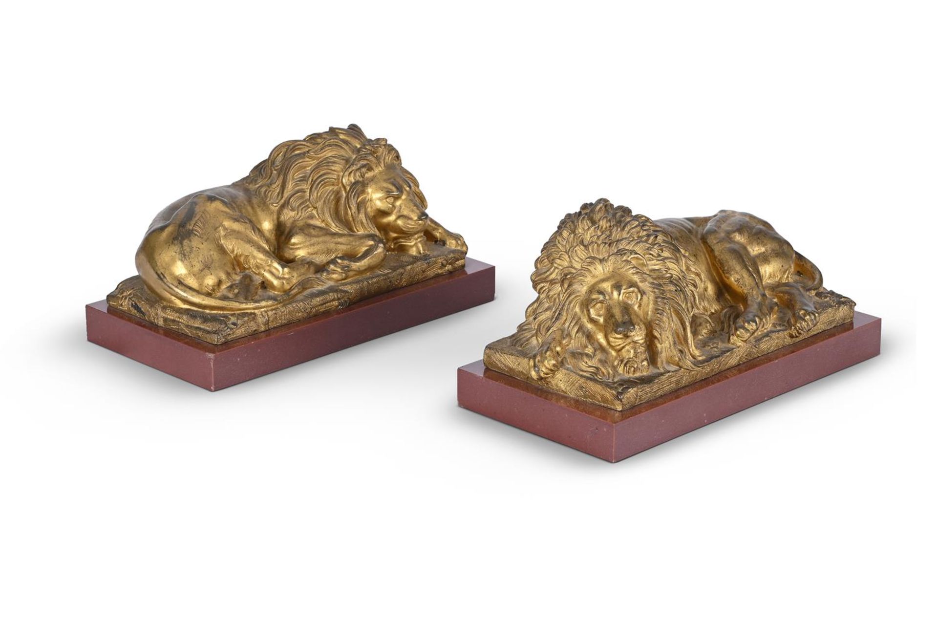 A PAIR OF GILT METAL FIGURES OF RECUMBENT LIONS, 19TH CENTURY - Image 2 of 2