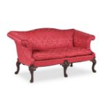 A MAHOGANY AND UPHOLSTERED SETTEE, IN GEORGE II STYLE, 20TH CENTURY