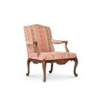 A CARVED MAHOGANY AND UPHOLSTERED OPEN ARMCHAIR, IN GEORGE III STYLE, LATE 19TH/EARLY 20TH CENTURY