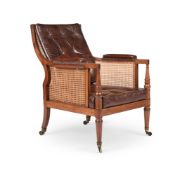 A GEORGE III MAHOGANY LIBRARY BERGERE ARMCHAIR, ATTRIBUTED TO GILLOWS, CIRCA 1810