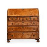 A GEORGE I BURR WALNUT, WALNUT AND FEATHER BANDED BUREAU, CIRCA 1720