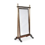 A CONTINENTAL MAHOGANY, EBONISED AND BRASS CHEVAL MIRROR, FIRST HALF 19TH CENTURY