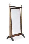 A CONTINENTAL MAHOGANY, EBONISED AND BRASS CHEVAL MIRROR, FIRST HALF 19TH CENTURY