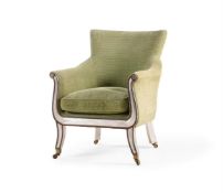 A CREAM PAINTED AND SILVERED LIBRARY BERGERE ARMCHAIR, IN THE MANNER OF HENRY HOLLAND