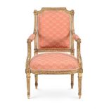 A CARVED GILTWOOD AND UPHOLSTERED ARMCHAIR, IN LOUIS XVI STYLE, SECOND HALF 19TH CENTURY