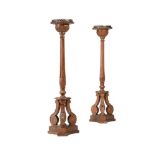 A PAIR OF REGENCY CARVED PINE TORCHERES, EARLY 19TH CENTURY