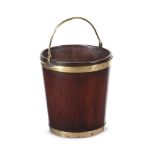 AN IRISH GEORGE III MAHOGANY AND BRASS BOUND PEAT BUCKET, CIRCA 1770