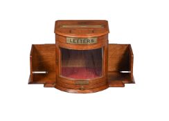 AN EDWARDIAN OAK AND BRASS TABLE TOP LETTER BOX, CIRCA 1905