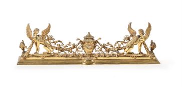 A SUBSTANTIAL BRASS FIRE FENDER, LATE 19TH OR EARLY 20TH CENTURY