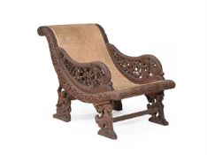 Y A CARVED EXOTIC HARDWOOD PLANTER'S CHAIR, INDIAN OR SOUTH EAST ASIAN, 19TH CENTURY
