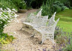TWO WEATHERED CAST IRON GARDEN BENCHES, 20TH CENTURY
