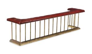 A BRASS AND LEATHER CLUB FENDER, CIRCA 1880-1910