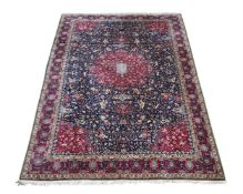 A TABRIZ CARPET INSCRIBED WITH A POEM, approximately 554 x 358cm