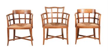 A GROUP OF THREE OAK AND RUSH SEAT ARMCHAIRS, BY HEAL & SON LTD, CIRCA 1930