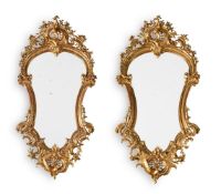 A PAIR OF ITALIAN CARVED GILTWOOD MIRRORS, PROBABLY FLORENTINE, LATE 19TH CENTURY