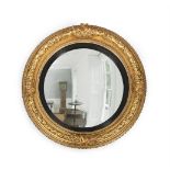 A VICTORIAN GILTWOOD AND GESSO CONVEX MIRROR, CIRCA 1840