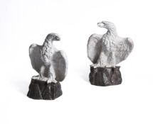 A PAIR OF CONTINENTAL WHITE-GLAZED TERRACOTTA MODELS OF EAGLES, EARLY 20TH CENTURY