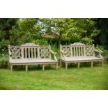 A PAIR OF CARVED TEAK 'HAREWOOD' GARDEN BENCHES AFTER THE 18TH CENTURY DESIGN, OF RECENT MANUFACTURE