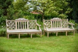 A PAIR OF CARVED TEAK 'HAREWOOD' GARDEN BENCHES AFTER THE 18TH CENTURY DESIGN, OF RECENT MANUFACTURE