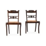 Y A PAIR OF CEYLONESE CARVED EBONY SIDE CHAIRS, SECOND QUARTER 19TH CENTURY