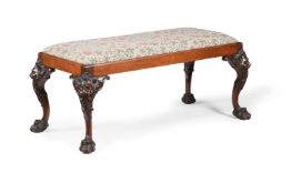 A CARVED MAHOGANY CENTRE OR WINDOW STOOL, IN GEORGE II STYLE, 20TH CENTURY