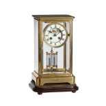 A FRENCH LACQUERED BRASS FOUR-GLASS MANTEL CLOCK