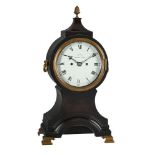 † A GEORGE III EBONISED BALLOON-SHAPED TABLE/BRACKET CLOCK WITH FIRED ENAMEL DIAL