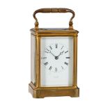 A FRENCH GILT BRASS CARRIAGE TIMEPIECE