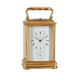 A FRENCH GILT BRASS CANNELEE CASED REPEATING CARRIAGE CLOCK WITH ALARM