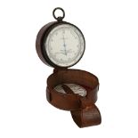 AN OXIDISED BRASS ANEROID POCKET BAROMETER WITH ALTIMETER