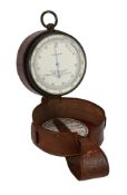 AN OXIDISED BRASS ANEROID POCKET BAROMETER WITH ALTIMETER