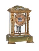 A FRENCH GILT BRASS, GREEN ONYX AND CHAMPLEVE ENAMELLED FOUR-GLASS MANTEL CLOCK