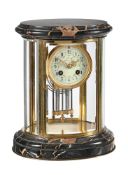 A FRENCH BRASS AND NOIR SAN LAURANT MARBLE OVAL FOUR-GLASS MANTEL CLOCK