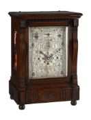 A VICTORIAN AESTHETIC STYLE CARVED OAK QUARTER-CHIMING BRACKET CLOCK