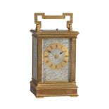 A FRENCH GILT BRASS REPEATING CARRIAGE CLOCK WITH PARCEL SILVERED ENGRAVED PANELS