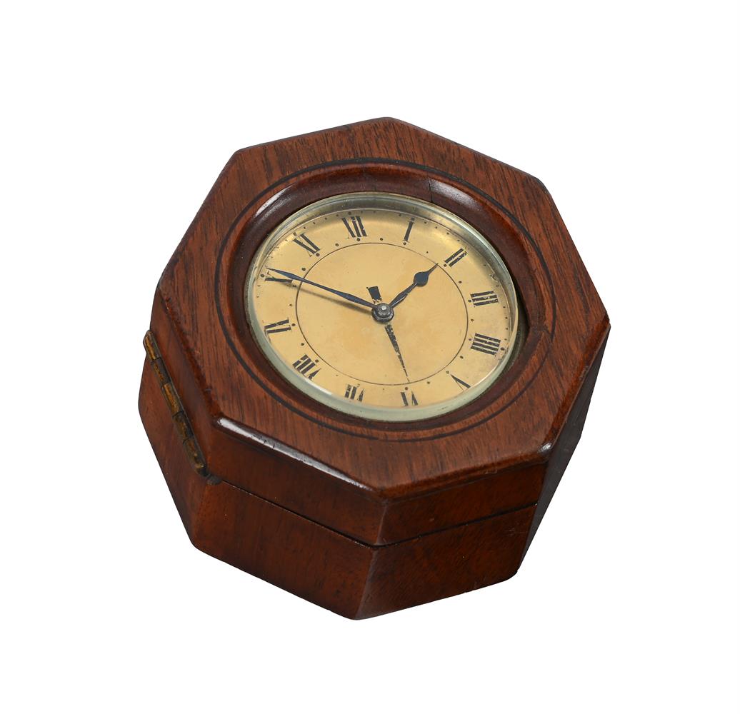 A VICTORIAN SMALL BRASS TRAVELLING ALARM TIMEPIECE WITH OCTAGONAL MAHOGANY...