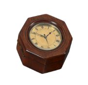 A VICTORIAN SMALL BRASS TRAVELLING ALARM TIMEPIECE WITH OCTAGONAL MAHOGANY OUTER GUARD BOX
