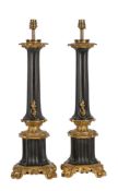 A PAIR OF GILT AND PATINATED METAL TABLE LAMPS IN FRENCH TASTE