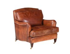 A LEATHER UPHOLSTERED ARMCHAIR