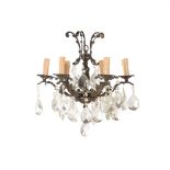 A GILT METAL AND FACETTED GLASS CHANDELIER