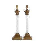 A PAIR OF GILT METAL AND CUT GLASS TABLE LAMPS