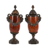 A PAIR OF GILT AND SILVERED METAL MOUNTED RED MARBLE URNS