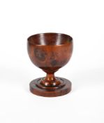 A TURNED YEW TABLE SALT OR DRINKING CUP