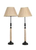 A PAIR OF LAMPS BLACK LACQUER AND FAUX IVORY TABLE LAMPS