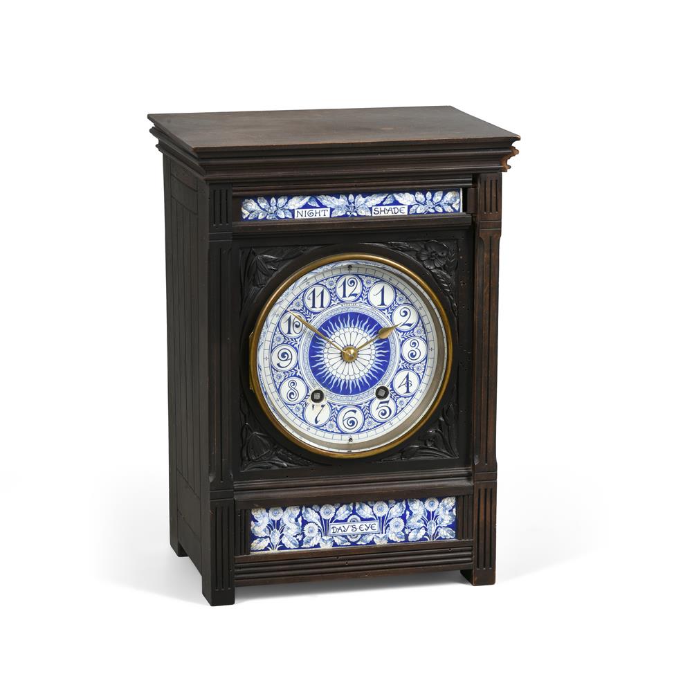 AN AESTHETIC MOVEMENT EBONISED AND PORCELAIN INSET MANTEL CLOCK