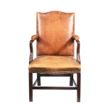 A LEATHER UPHOLSTERED OPEN ARMCHAIR IN GEORGE III STYLE