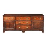 A GEORGE III NORTH COUNTRY OAK AND MAHOGANY BANDED DRESSER BASE